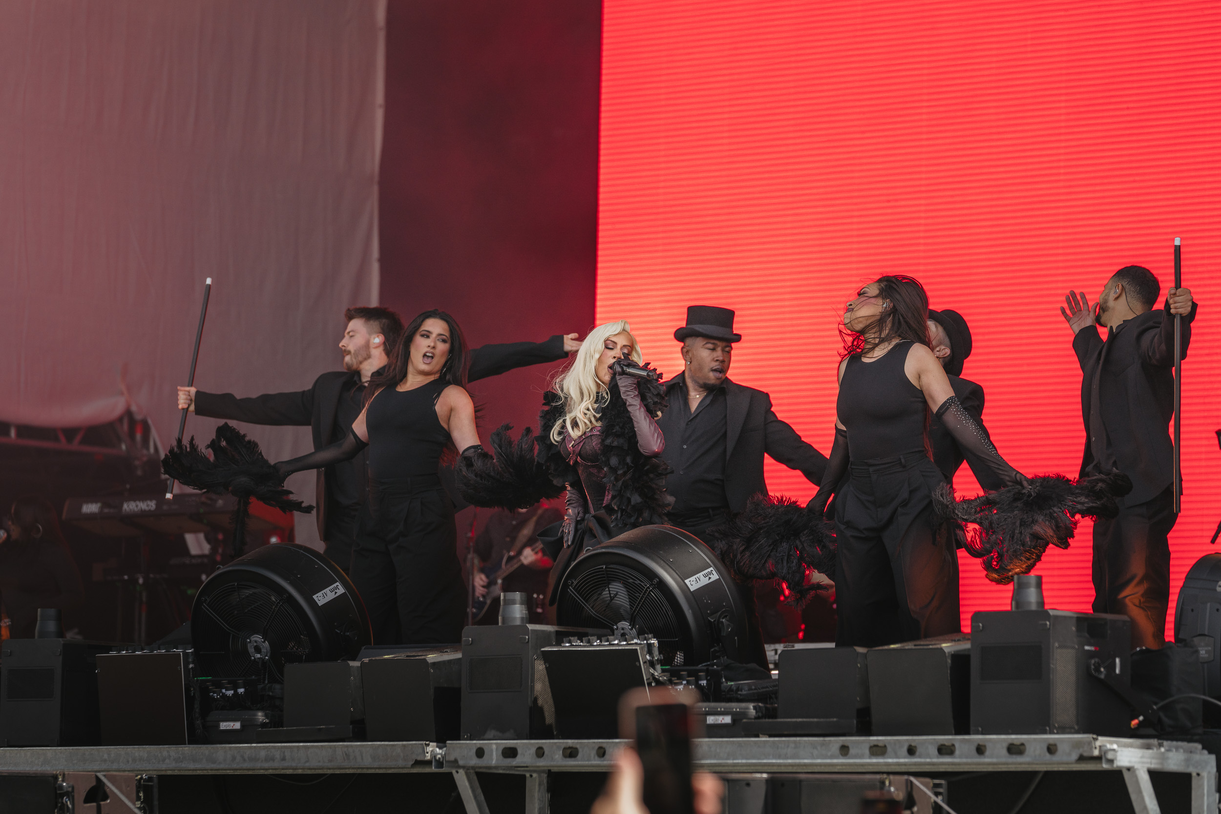 With Christina Aguilera backed by a troupe of dancers, impressive choreography, and several spectacular costume changes, the show evolved into a visually and musically stunning experience.